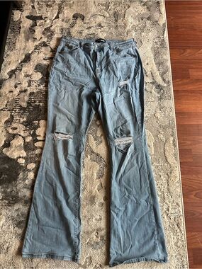 Fashion Nova Light Blue Ripped Flare Jeans